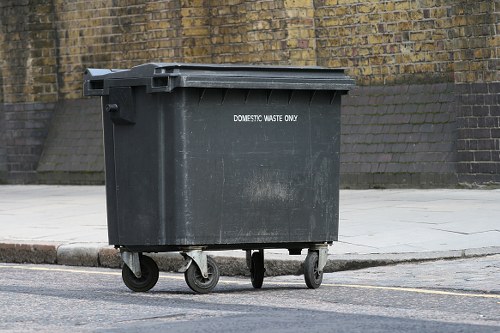 Volunteer charity workers collecting reusable furniture from a business
