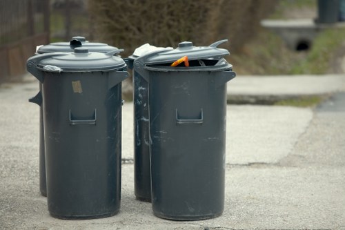 Staff sorting recyclables into separate bins for commercial premises